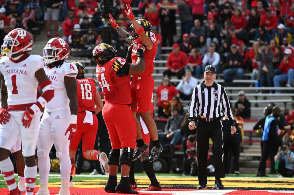 Oct 30, 2021; College Park, Maryland, USA;  Maryland Terrapins running back Challen Faamatau (29) celebrates with offensive lineman Spencer Anderson (54) after scoring a first half touchdown against the Indiana Hoosiers  at Capital One Field at Maryland Stadium.