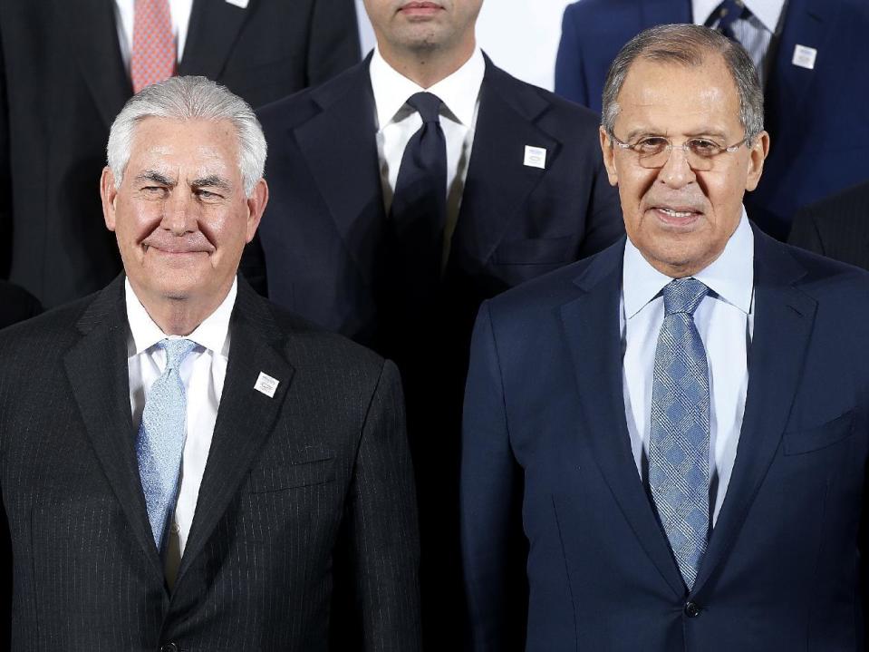 The Russian foreign minister Sergey Lavrov, right, and US Secretary of State Rex Tillerson stand together during the G-20 Foreign Ministers meeting in Bonn, Germany, Thursday, Feb. 16, 2017.(AP Photo/Michael Probst)