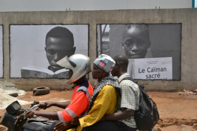 Posters are splashed across walls and billboards in Conakry as the city kicks off a year as the World Book Capital