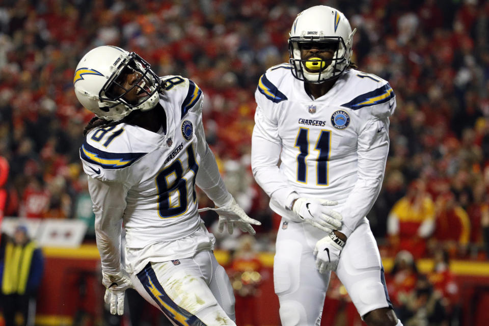 Los Angeles Chargers wide receiver Mike Williams (81) celebrates his touchdown with wide receiver Geremy Davis (11) during the second half of an NFL football game against the Kansas City Chiefs in Kansas City, Mo., Thursday, Dec. 13, 2018. (AP Photo/Charlie Riedel)