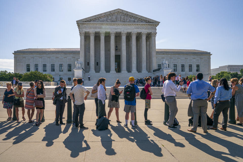 Visitors line up to enter the Supreme Court on Capitol Hill in Washington, Monday, June 24, 2019. (AP Photo/J. Scott Applewhite)