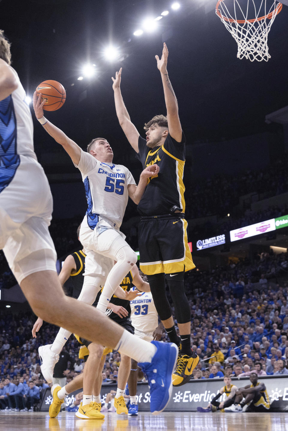 Creighton's Baylor Scheierman, left, shoots against Iowa's Owen Freeman during the first half of an NCAA college basketball game Tuesday, Nov. 14, 2023, in Omaha, Neb. (AP Photo/Rebecca S. Gratz)