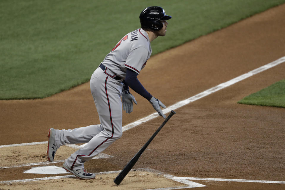 Atlanta Braves' Freddie Freeman watches his double during the first inning of the team's baseball game against the Miami Marlins, Saturday, Aug. 15, 2020, in Miami. (AP Photo/Lynne Sladky)