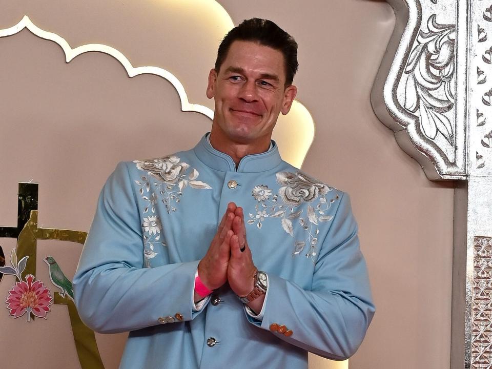 John Cena poses for photographers in.