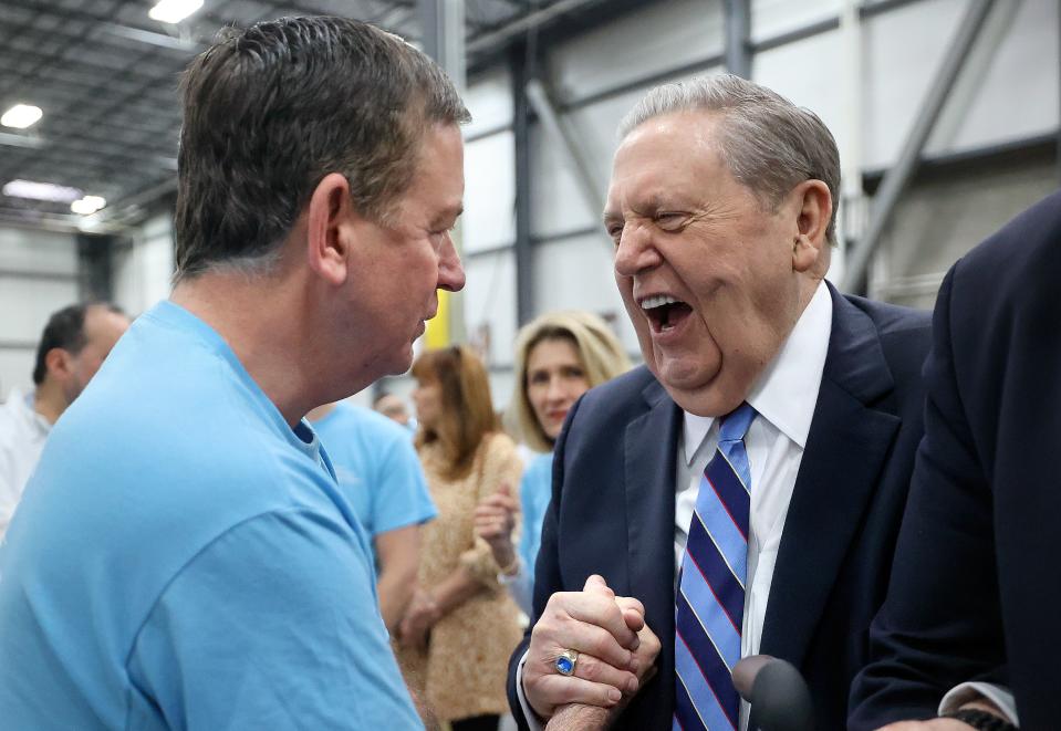 Barron Segar, president and CEO of World Food Program USA, shakes hands with President Jeffrey R. Holland on Feb. 8, 2024.