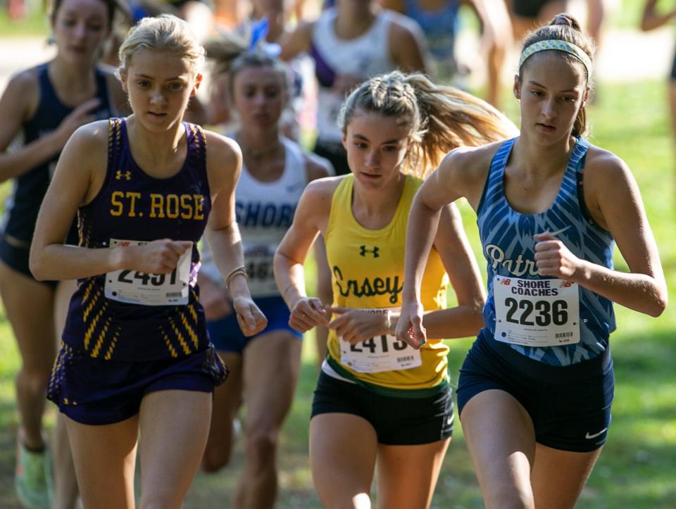 Cate DeSousa of Red Bank Catholic, center, wins the girls race. Monmouth County Cross Country Championships.   Holmdel, NJTuesday, October 11, 2022