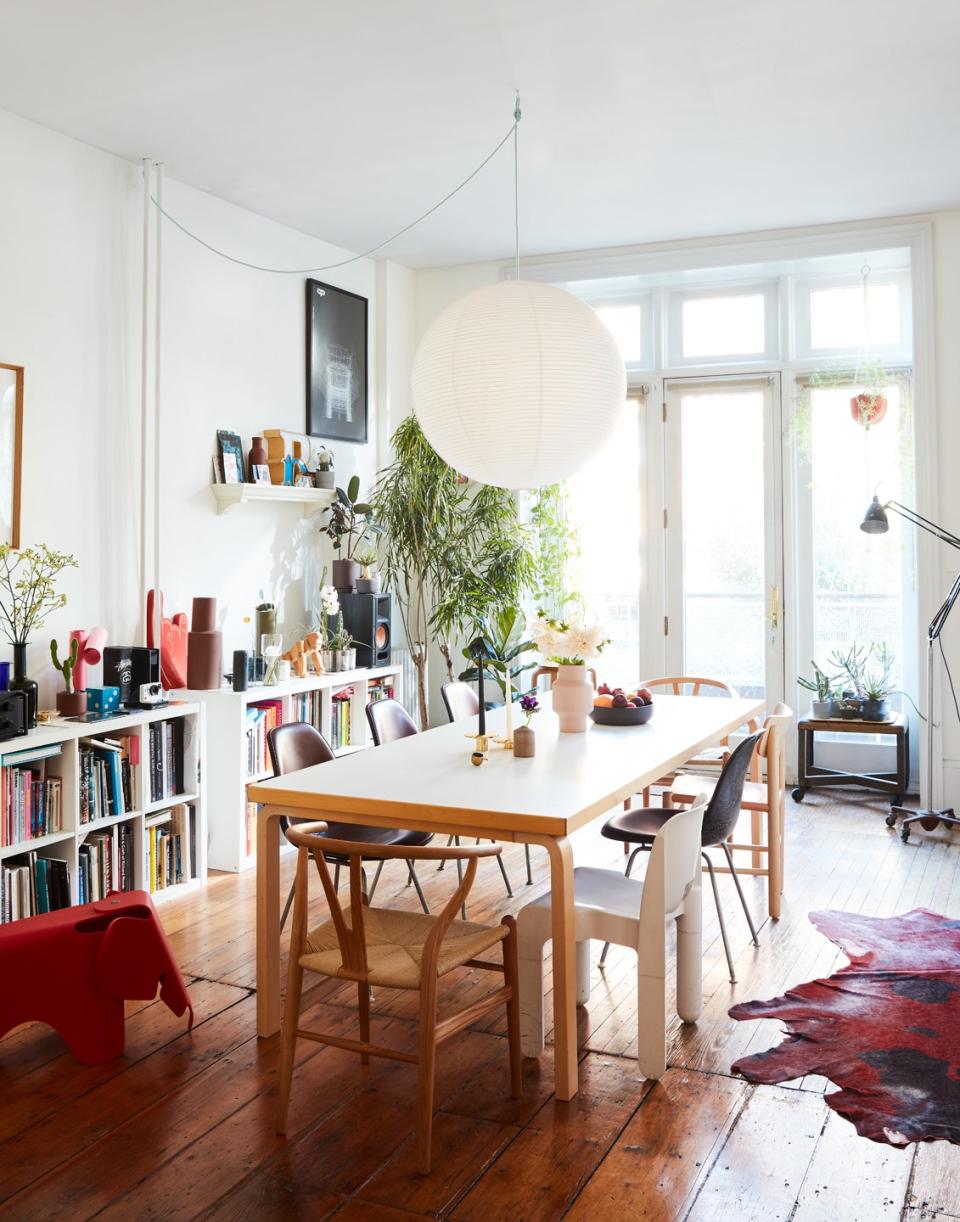 A Hay pendant hangs above the Artek dining table, a spot the couple have enjoyed coworking from during quarantine.