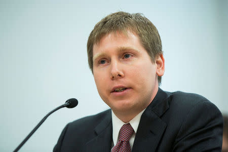FILE PHOTO: Bitcoin investor Barry Silbert speaks at a New York State Department of Financial Services (DFS) virtual currency hearing in the Manhattan borough of New York, U.S., January 28, 2014. REUTERS/Lucas Jackson/File Photo