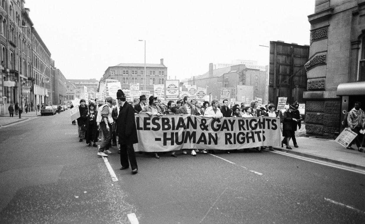Protesters in Manchester, U.K., 1988. <a href="https://www.gettyimages.com/detail/news-photo/clause-28-march-in-manchester-people-demonstrate-against-news-photo/930164184?adppopup=true" rel="nofollow noopener" target="_blank" data-ylk="slk:Reid/Mirrorpix via Getty Images;elm:context_link;itc:0;sec:content-canvas" class="link ">Reid/Mirrorpix via Getty Images</a>