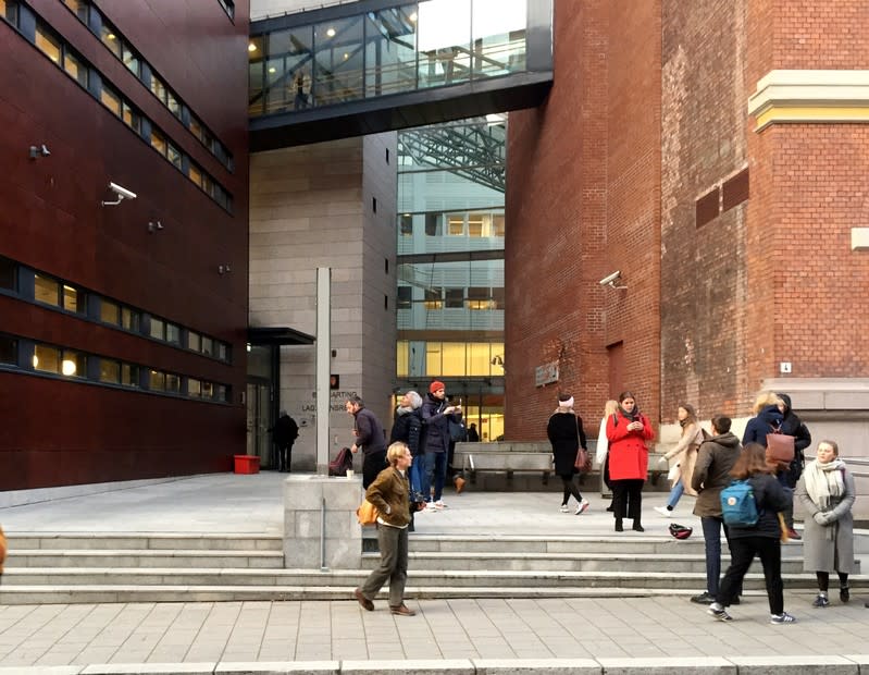 People gather next to the Borgarting Court of Appeals in Oslo