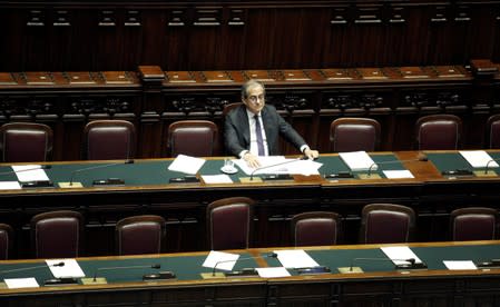 FILE PHOTO: Italian Economy Minister Giovanni Tria is seen in parliament as he speaks over the looming EU disciplinary action against Italy for excessive debt, in Rome