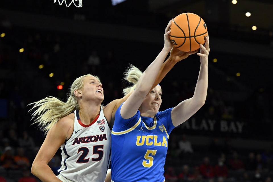 Arizona forward Cate Reese (25) defends against UCLA forward Brynn Masikewich during the first half of an NCAA college basketball game in the quarterfinal round of the Pac-12 women's tournament Thursday, March 2, 2023, in Las Vegas. (AP Photo/David Becker)