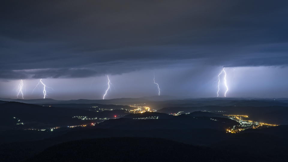 Lightning illuminates the sky over Salgotarjan, Hungary, late Wednesday, July 14, 2021. (Peter Komka/MTI via AP)