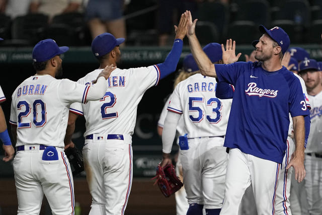 Texas Rangers' Andrew Heaney walks to the dugout before a baseball