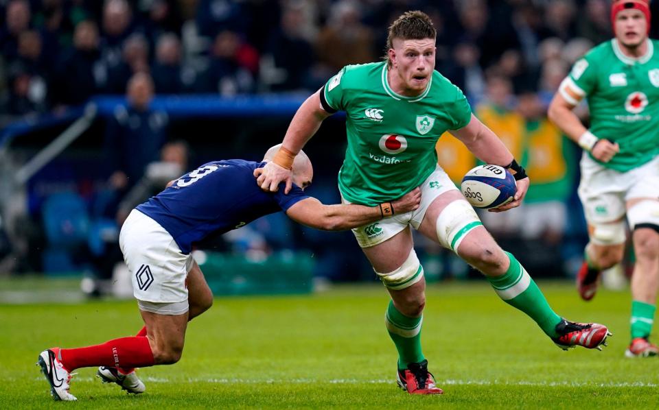 Ireland's Joe McCarthy is tackled by France's Maxime Lucu during the Guinness Six Nations match at the Orange Velodrome in Marseille, France