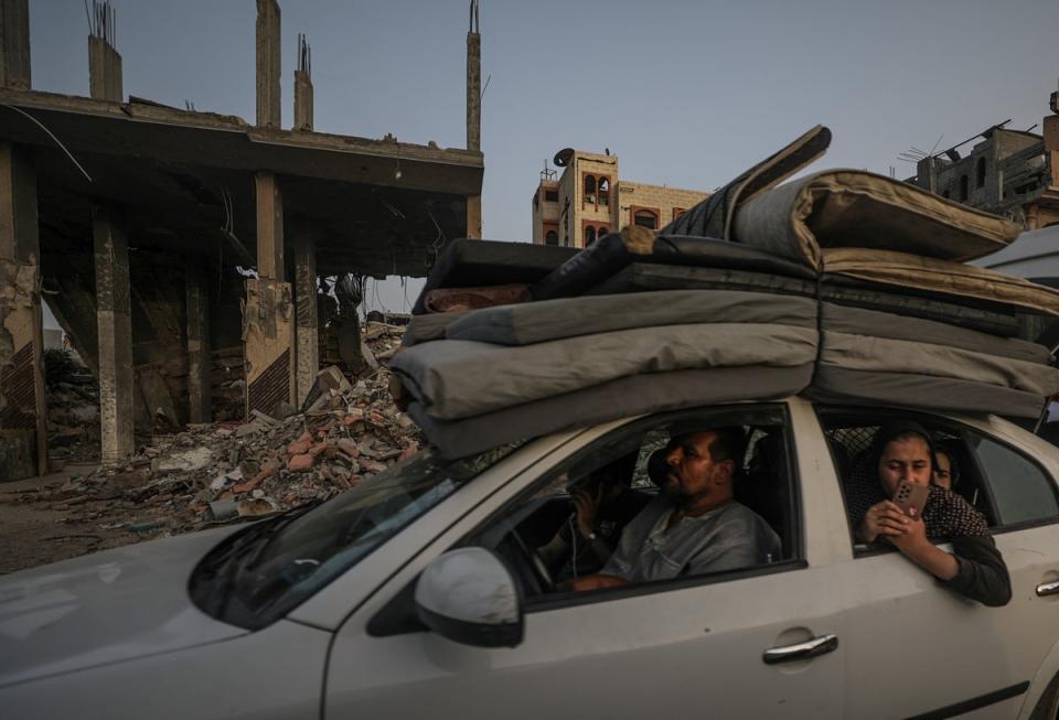 Palestinians arrive to Khan Younis after leaving Rafah following an evacuation order issued by the Israeli army (EPA)