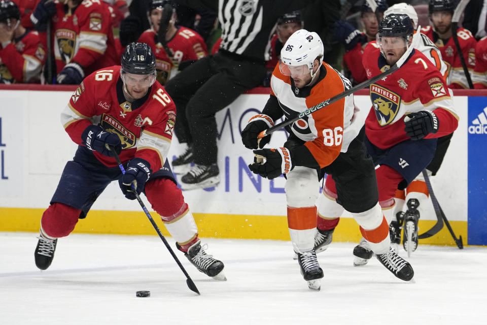 Florida Panthers center Aleksander Barkov (16) and Philadelphia Flyers left wing Joel Farabee (86) go for the puck during the first period of an NHL hockey game, Thursday, March 7, 2024, in Sunrise, Fla. (AP Photo/Lynne Sladky)