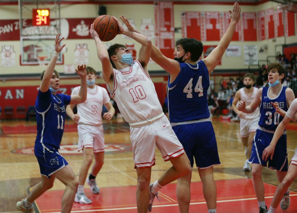 Tappan Zee's Mike Mooney (10) puts up a shot in front Pearl River's Kieran Bellew (44) during boys basketball action at Tappan Zee High School Jan. 20, 2022. 