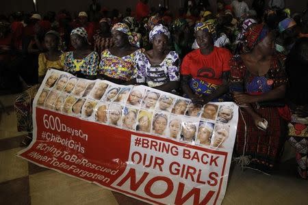 Parents of the Chibok girls hold a "Bring Back Our Girls" banner during their meeting with Nigeria's President Muhammadu Buhari at the presidential villa in Abuja, Nigeria, in this file photo dated January 14, 2016. REUTERS/Afolabi Sotunde