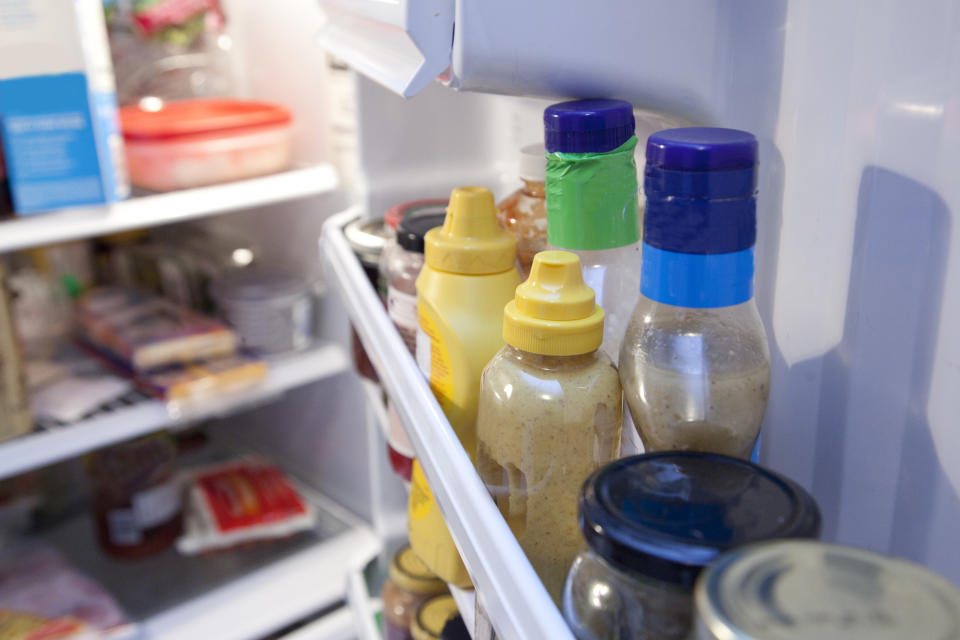 Bottles and containers inside a fridge