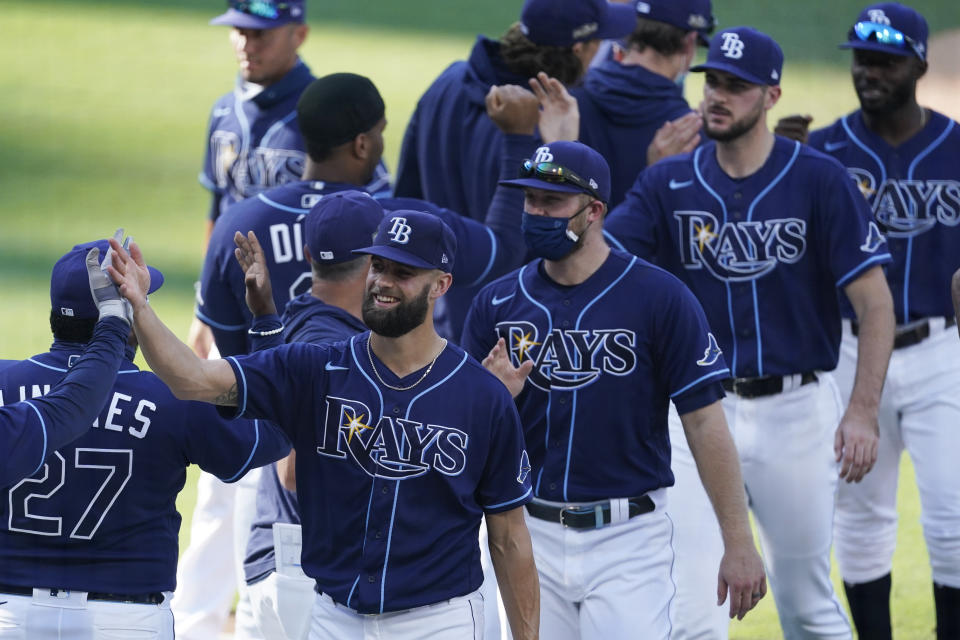 Tampa Bay Rays celebrate their Game 2 victory over the Houston Astros in a baseball American League Championship Series, Monday, Oct. 12, 2020, in San Diego. The Rays defeated the Astros 4-2 to lead the series 2-0 games. (AP Photo/Ashley Landis)