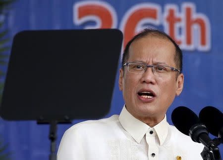 President Benigno Aquino reads his speech through a teleprompter during a graduation ceremony of police cadets at the Philippine National Police academy in Silang, Cavite south of Manila March 26, 2015. REUTERS/Erik De Castro