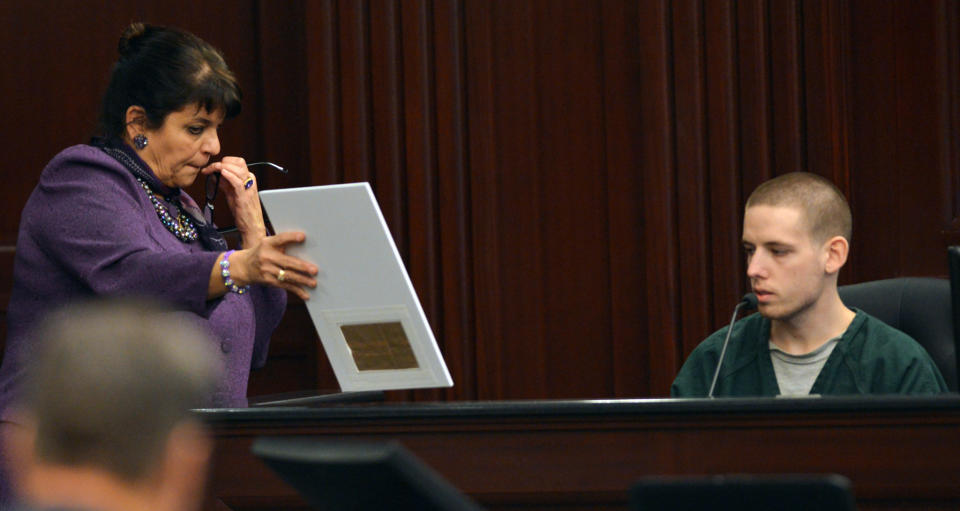 State Attorney Angela Corey, left, questions Shawn Atkins during the trial of Michael Dunn, Thursday, Feb. 6, 2014, in Jacksonville, Fla. Atkins witnessed the shooting and reported Dunn's license plate number to police. Dunn is accused of shooting Jordan Davis who was outside a store listening to music with his friends in November 2012. (AP Photo/Bob Mack, Pool)