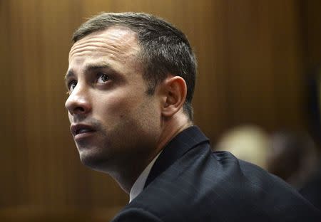 "Blade Runner" Oscar Pistorius sits in the dock in the North Gauteng High Court in Pretoria, in this file picture taken March 4, 2014. REUTERS/Antoine de Ras/Pool /Files