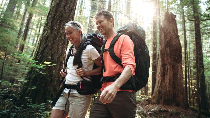 A couple in their mid- 50's enjoy an extended hike in the Pacific Northwest.