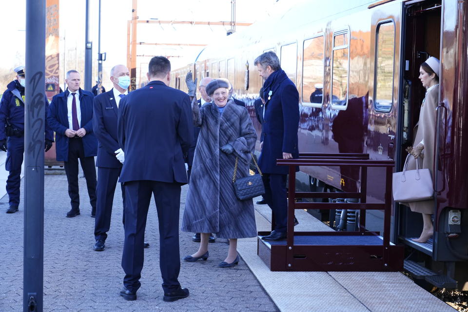 Queen Margrethe, Crown Prince Frederik and Crown Princes Mary arrives at Roskilde train station on their way to Roskilde Cathedral on the day of Queen Margrethe 50th Regent's Anniversary at Christiansborg Castle, Copenhagen, Friday Jan. 14, 2022. Denmark’s popular monarch Queen Margrethe is marking 50 years on the throne with low-key events. The public celebrations for Friday's anniversary have been delayed until September due to the pandemic. (Claus Bech/Ritzau Scanpix via AP)