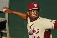 Florida State relief pitcher Jameis Winston (44) warms up in the bullpen in the eighth inning of an NCAA college baseball game against Miami on Sunday, March 2, 2014, in Tallahassee, Fla. Florida State won 13-6. (AP Photo/Phil Sears)