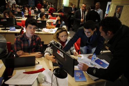 Volunteers work on the verification of election results at the main opposition Republican People's Party (CHP) headquarters in Ankara April 1, 2014. REUTERS/Umit Bektas
