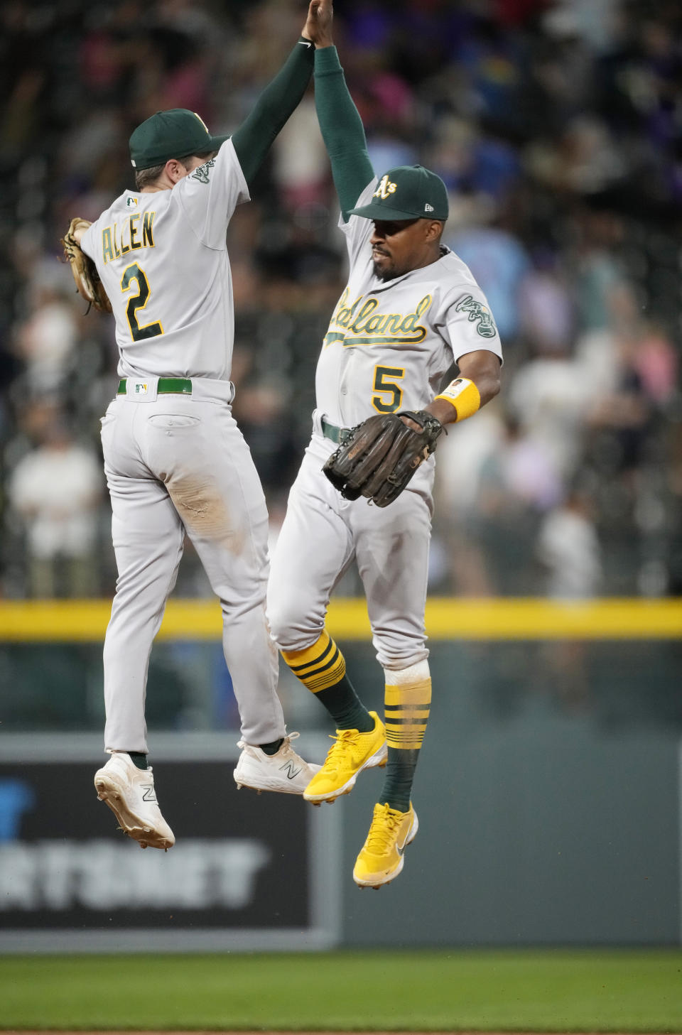 Oakland Athletics shortstop Nick Allen, left, celebrates with left fielder Tony Kemp after the team's win in a baseball game against the Colorado Rockies on Friday, July 28, 2023, in Denver. (AP Photo/David Zalubowski)