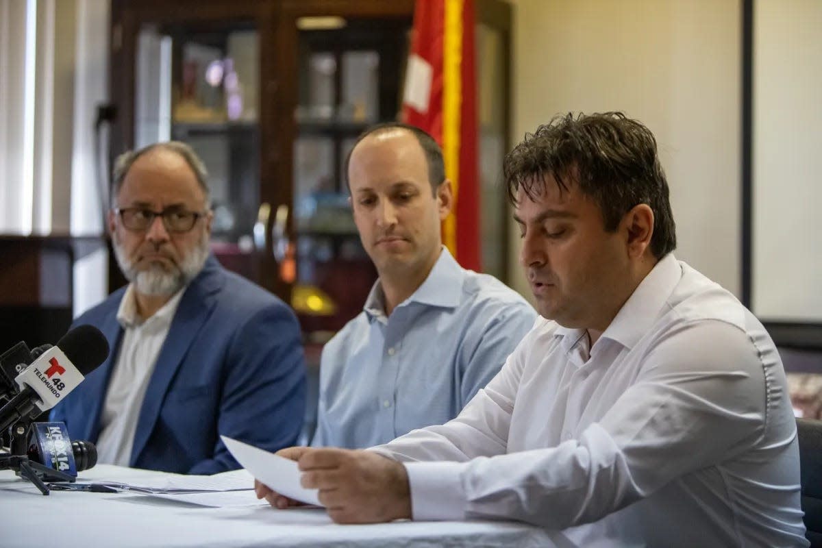 Community leaders Omar Hernandez of the Islamic Center, Rabbi Ben Zeidman of Temple Mount Sinai and Lufti Dagci of the Raindrop Turkish House gather on Thursday evening to sign a joint statement of respect for life and unity against hatred.