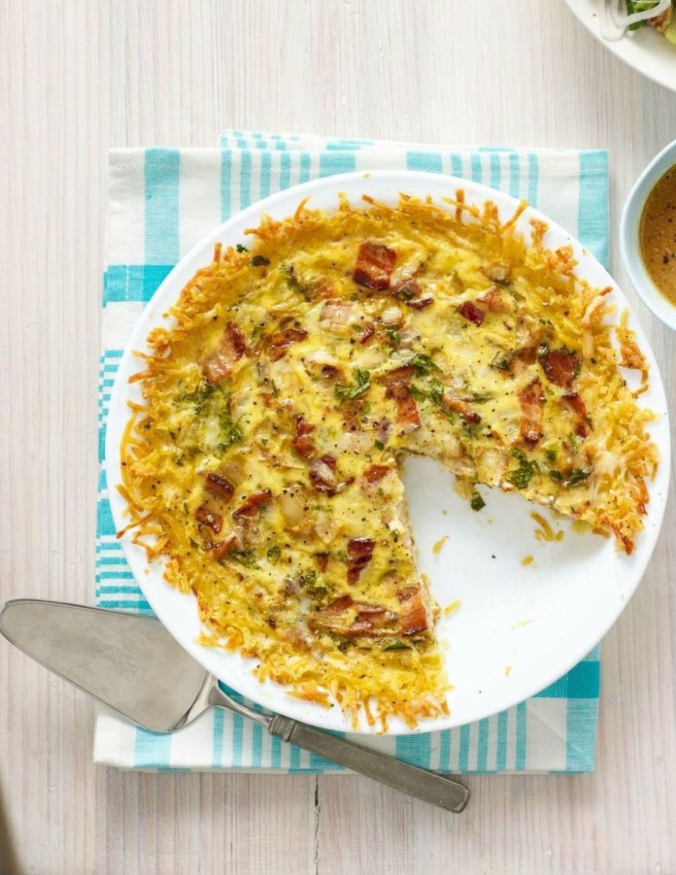 breakfast in bed quiche lorraine with hash brown crust on white plate