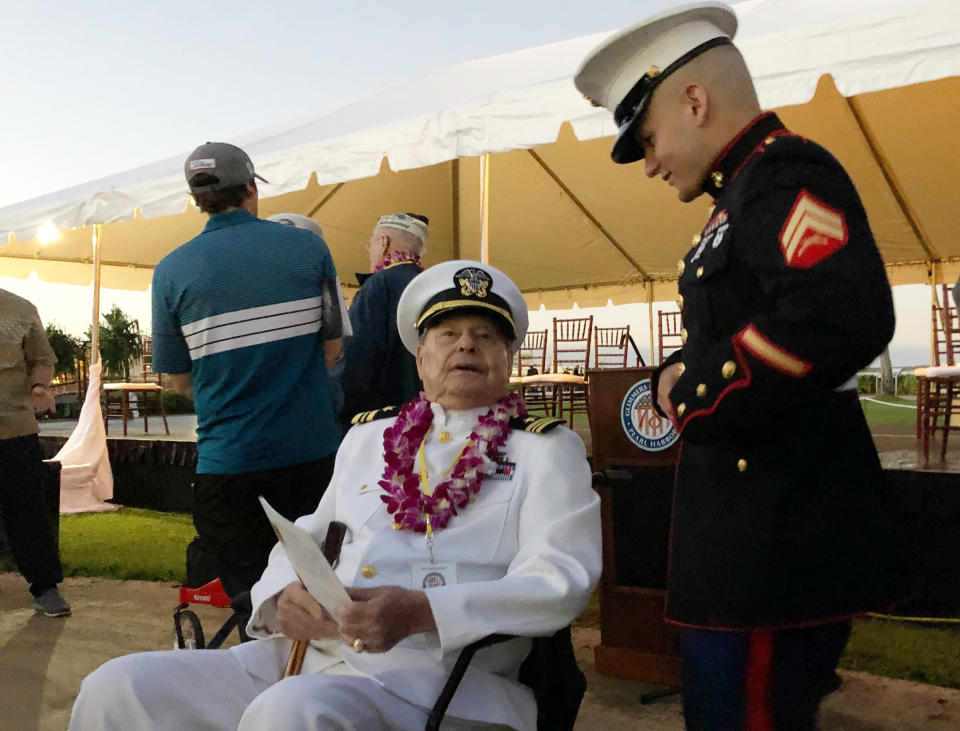FILE - Marine Cpl. Zachariah Jeavons, of Binghamton, N.Y., meets Pearl Harbor survivor Lou Conter, 98, who was aboard the USS Arizona when the Japanese attacked in 1941, Dec. 7, 2019, at Pearl Harbor, Hawaii, on the 78th anniversary of the attack. Conter, the last living survivor of the USS Arizona battleship that exploded and sank during the Japanese bombing of Pearl Harbor, died on Monday, April 1, 2024, following congestive heart failure, his daughter said. He was 102. (AP Photo/Caleb Jones, File)