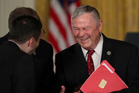 U.S. Representative Dana Rohrabacher speaks with fellow attendees before President Donald Trump's remarks at a meeting of the National Space Council at the White House in Washington, U.S. June 18, 2018. REUTERS/Jonathan Ernst