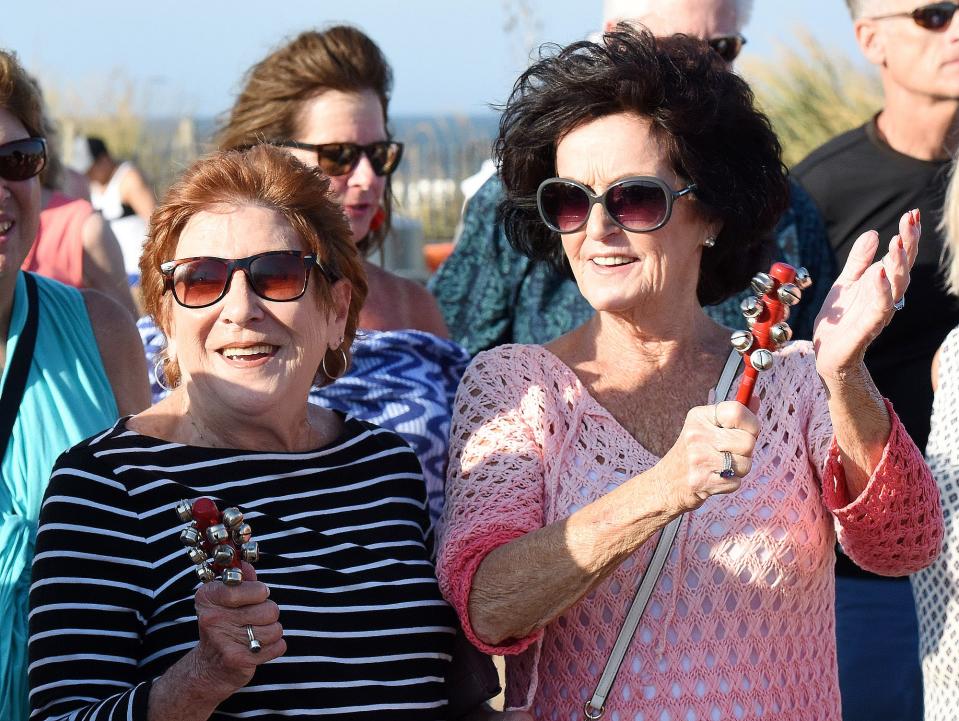 Rehoboth residents Sydney Artz and Linda DiDomeniques help provide the music during the Rehoboth Beach jazz funeral in this file photo.