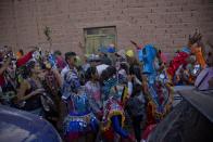 In this Feb. 25, 2017, photo, revelers dance during carnival celebrations in the remote Andean town of Uquia, Argentina. During the 9 days that the festivity lasts there, carnival revelers dressed as devils are not supposed to take their costumes off or reveal their identity. (AP Photo/Alvaro Medina)