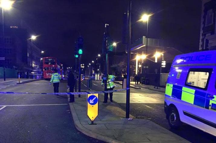 Police officers taped off the road after the incident in east London last year (Saleh Ahmed)