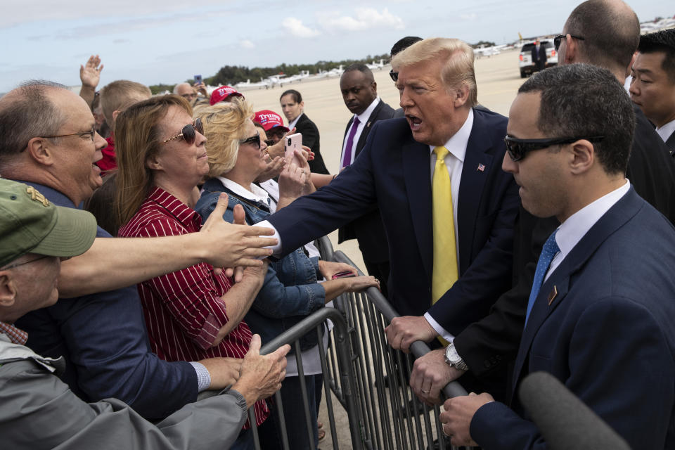 President Trump shakes hands with supporters