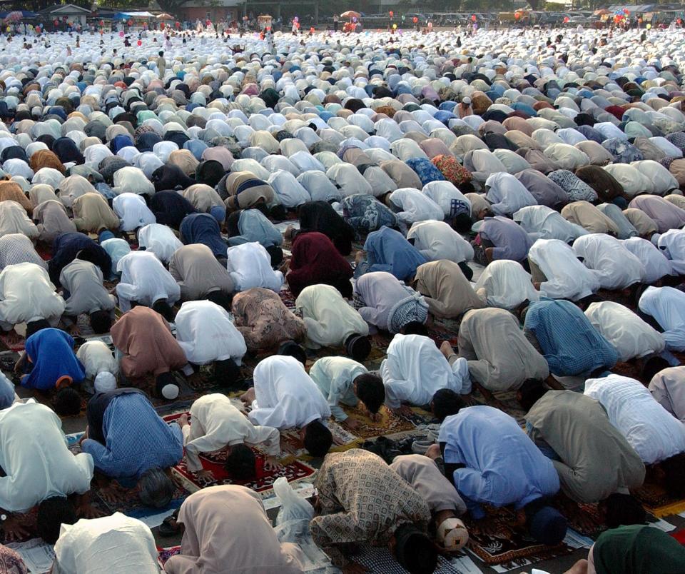 Millions of Indonesian Muslims pray to celebrate the end of Ramadan Eid al-Fitr, the month long of fasting, in Jakarta. 05 December 2002.