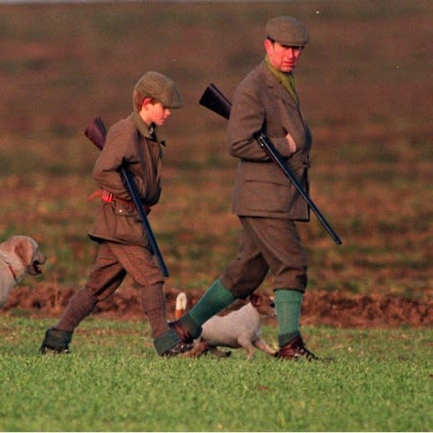 A young Prince Harry shooting with his father the Prince of Wales in 1996 - Credit: BENNETT / PARKER