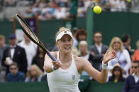 Alison Riske of the US returns the ball to Switzerland's Ylena In-Albon during their women's singles tennis matchon day one of the Wimbledon tennis championships in London, Monday, June 27, 2022. (AP Photo/Alberto Pezzali)