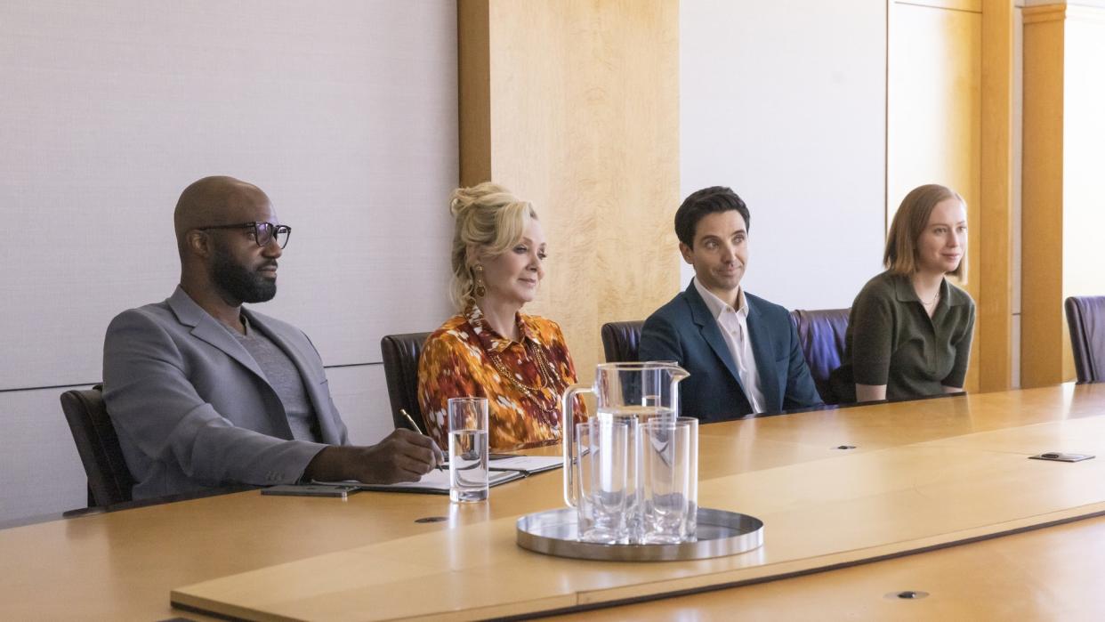  Carl Clemons-Hopkins, Jean Smart, Paul W. Downs, Hannah Einbinder at a conference table in Hacks. 