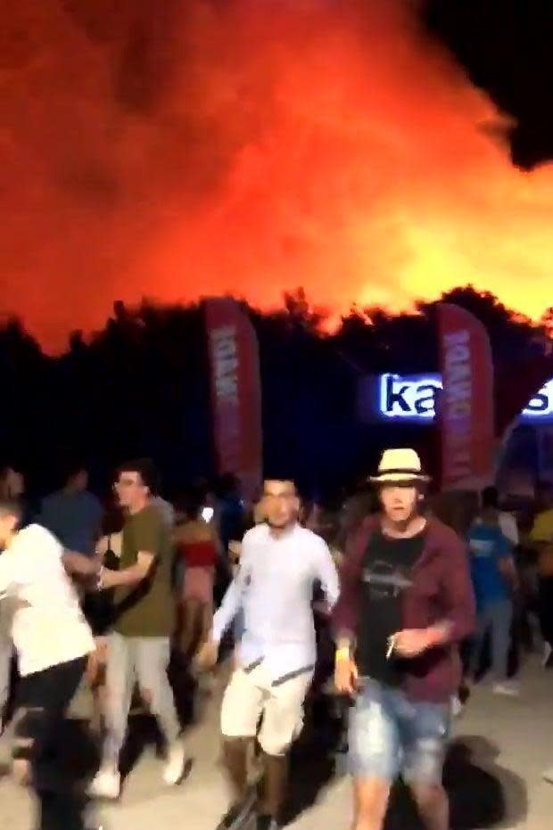 Festival-goers flee the inferno