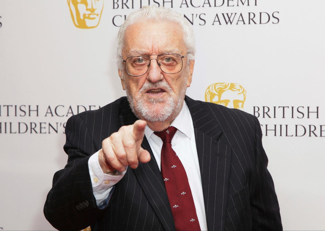 FILE - Actor Bernard Cribbins OBE poses for photographers as he arrives for the British Academy Children's Awards in London, Sunday, Nov. 23 2014. Cribbins, a beloved British entertainer whose seven-decade career ranged from the bawdy “Carry On” comedies to children’s television and “Doctor Who,” has died. He was 93. Agent Gavin Barker Associates announced Cribbins’ death on Thursday, July 28, 2022. (Photo by Grant Pollard/Invision/AP, File)
