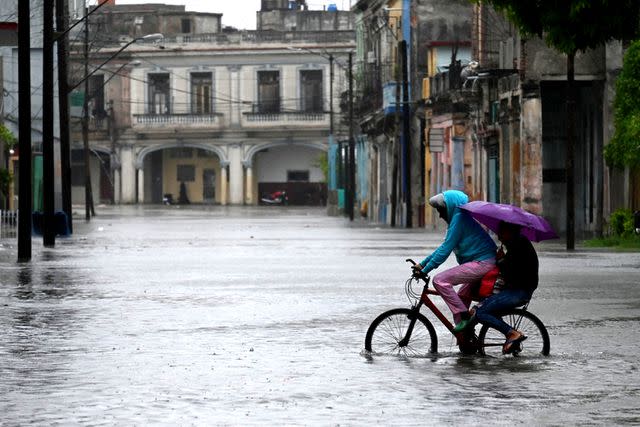 <p>Yamil Lage via Getty</p> Flooding from Tropical Storm Idalia in Cuba