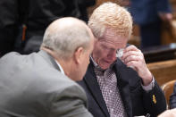 Attorney Jim Griffin speaks with Alex Murdaugh tears up after the jury was excused and the defense and prosecution teams discuss how to handle sensitive crime scene photos during his double murder trial at the Colleton County Courthouse in Walterboro, S.C, Wednesday, Jan. 25, 2023. (Joshua Boucher/The State via AP)