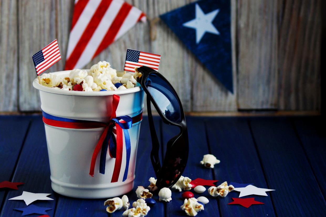 popcorn in bucket with patriotic decorations, sunglasses